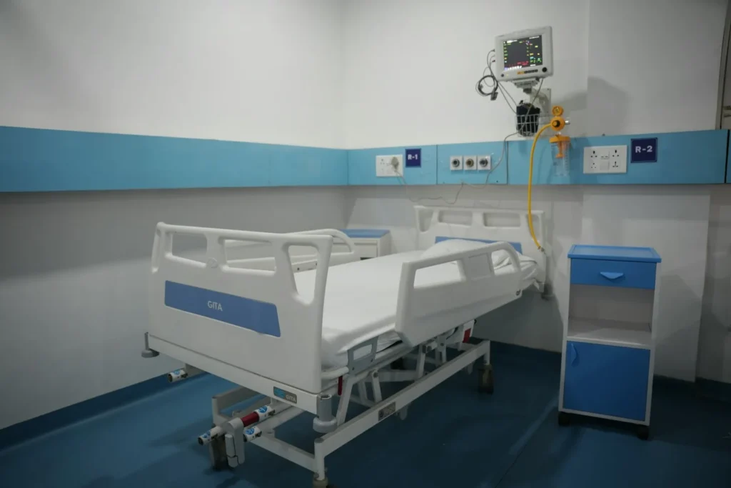 Modern hospital room with an adjustable bed and medical equipment