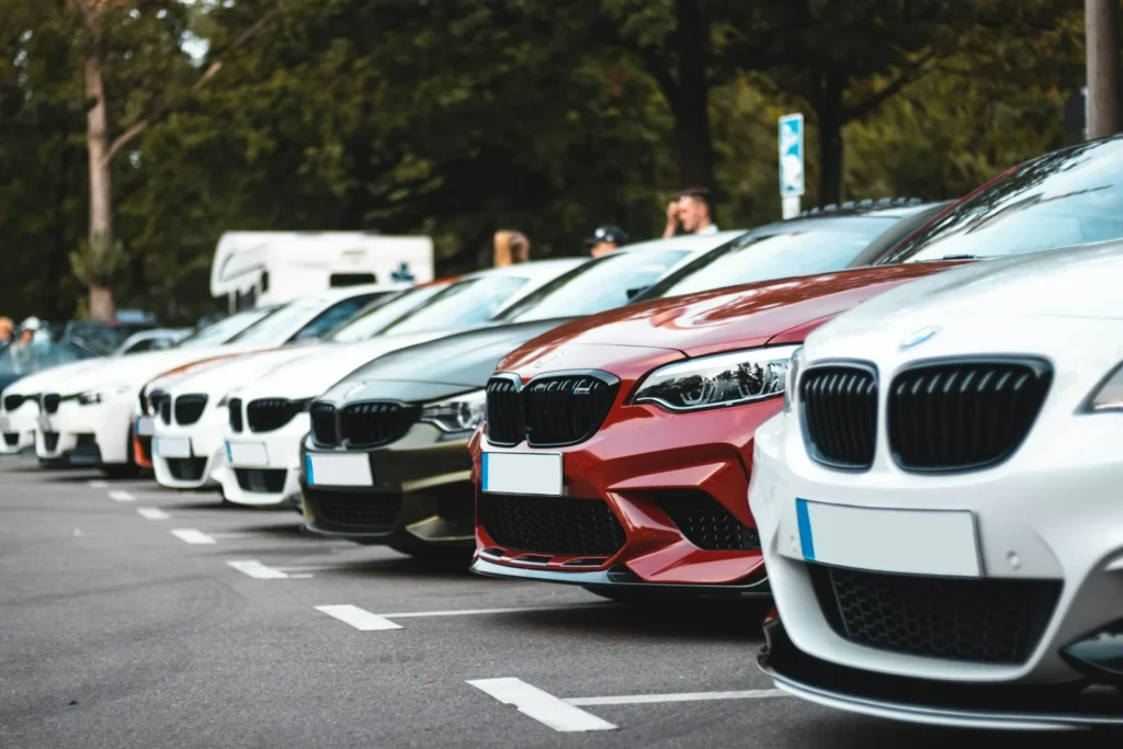 Row of new cars parked on a lot
