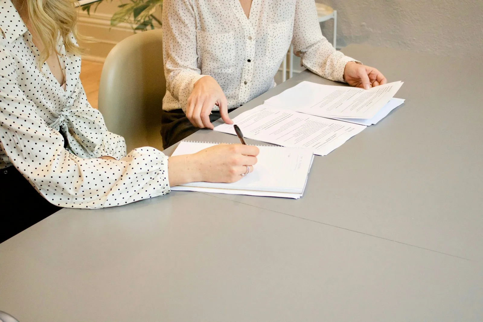 Signing registration documents at a desk