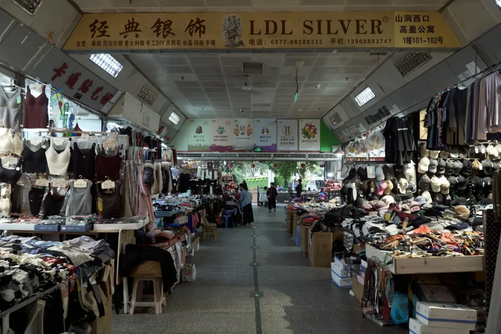 Wholesale market hall with stalls of goods in China