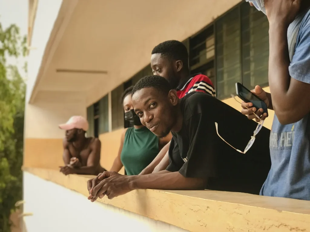 Students talking together on a university balcony