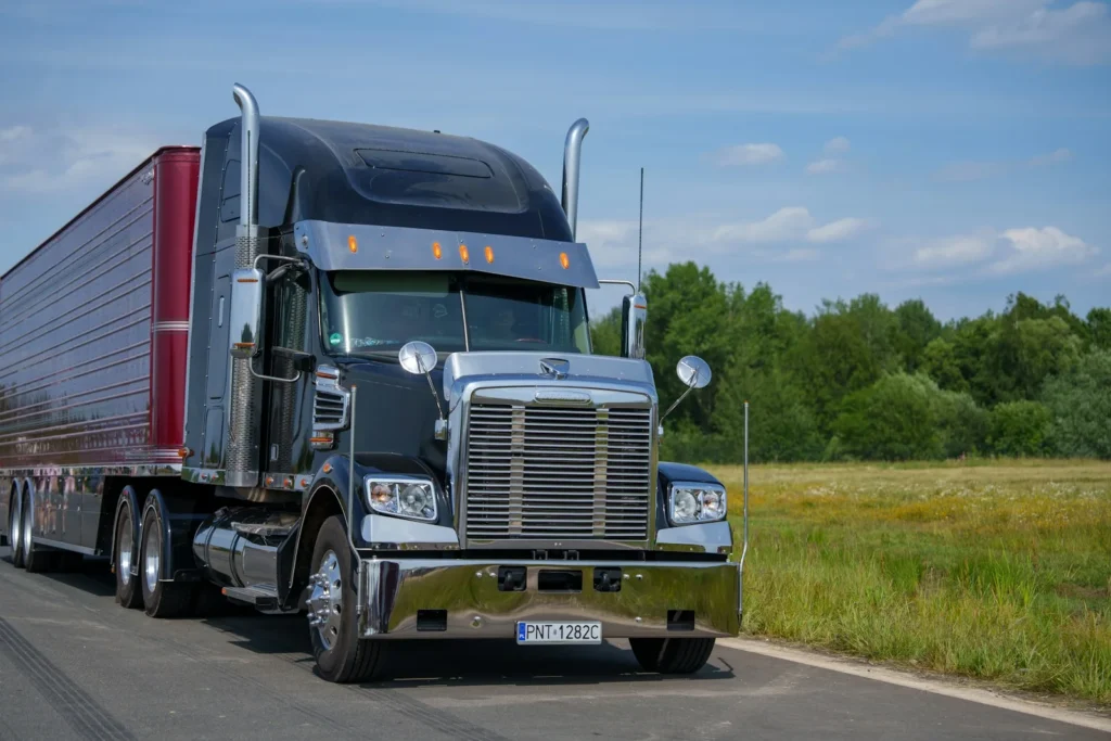 Freight truck driving on a country road