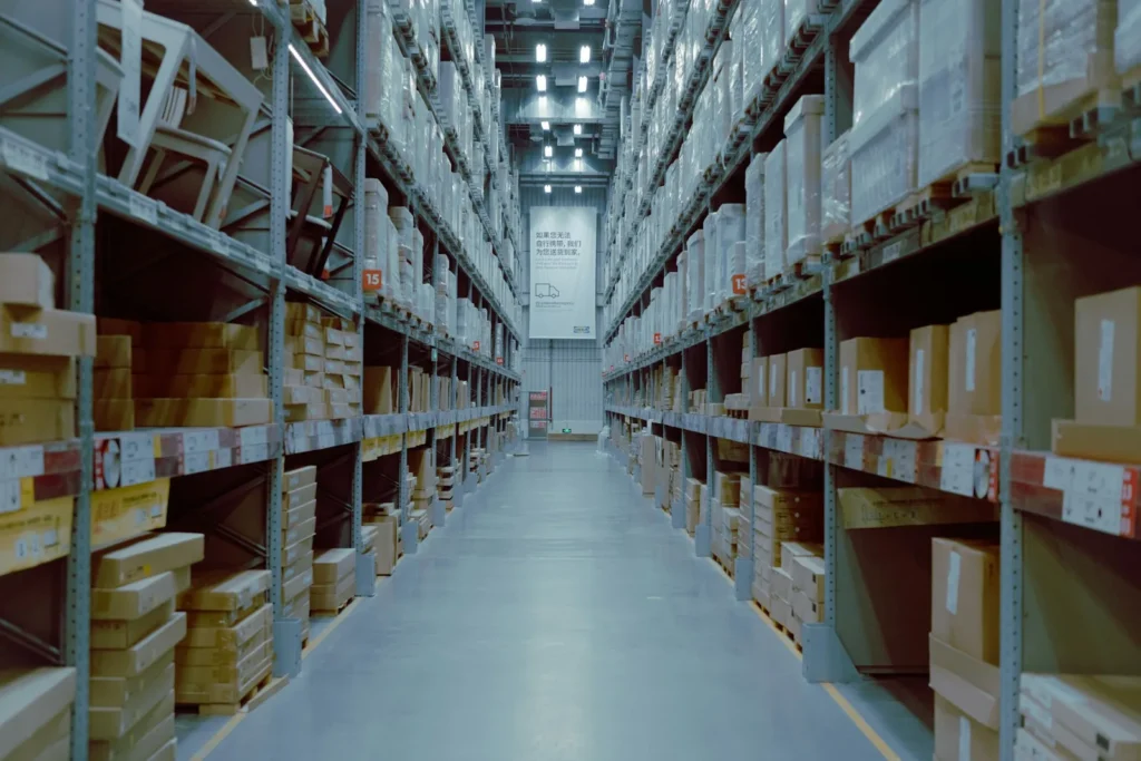 Warehouse aisle with shelves of cartons